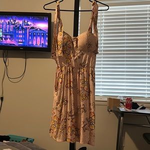 A pink flowery dress with pockets,medium